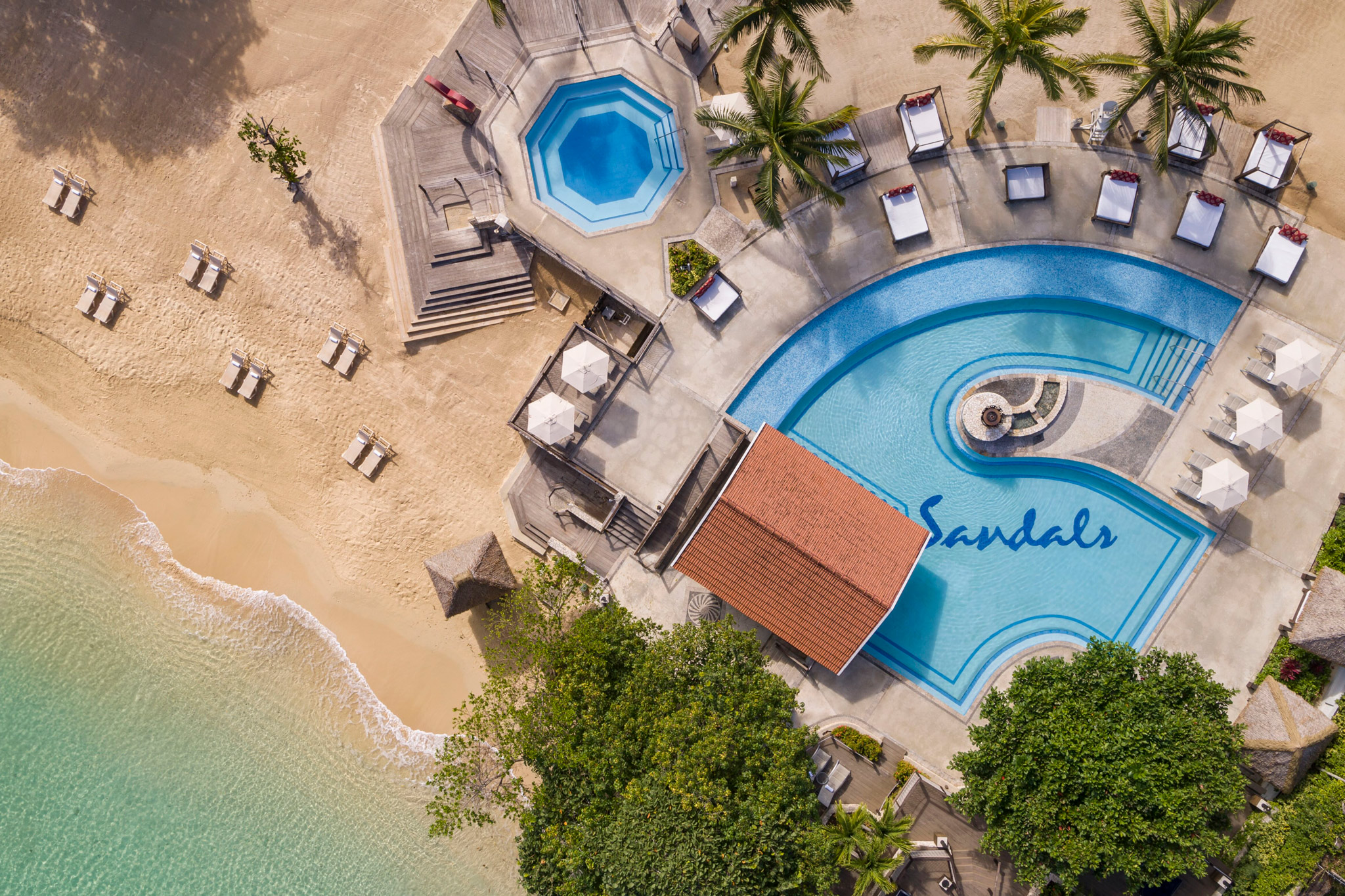 Best Sandals Resort: All 18 Ranked by Someone With No Commission 1 Aerial view of a Sandals resort pool and beach in the Caribbean